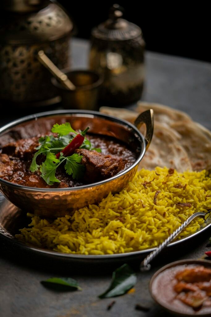 Chicken Biriani — aromatic spiced rice served with curry.